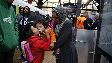 Беженцы из Сирии на железнодорожной станции в Копенгагене