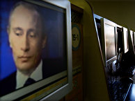 Изображение Владимира Путина на экране компьютера в интернет-кафе
