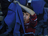 Беженец из Сирии работает в мастерской одежды в Газиантепе на юго-востоке Турции