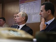 Владимир Путин и президент Сирийской Арабской Республики Башар Асад во время посещения авиабазы Хмеймим в Сирии. 11 декабря 2017 Владимир Путин и президент Сирийской Арабской Республики Башар Асад во время посещения авиабазы Хмеймим в Сирии. 11 декабря 2017