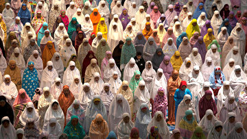 Muslim women attend prayers at the first day of the holy fasting month of Ramadan