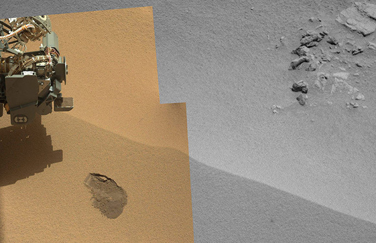 Марсоход берет пробу почвы рядом с Рокнестом