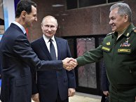 Президент РФ Владимир Путин, президент Сирии Башар Асад и министр обороны РФ Сергей Шойгу во время встречи в командном пункте группировки Вооруженных Сил России в Сирии Президент РФ Владимир Путин, президент Сирии Башар Асад и министр обороны РФ Сергей Шойгу во время встречи в командном пункте группировки Вооруженных Сил России в Сирии