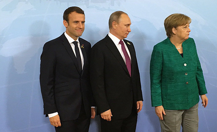 Президент России Владимир Путин, канцлер ФРГ Ангела Меркель и президент Франции Эммануэль Макрон во время встречи на саммите G20 в Гамбурге. 8 июля 2017