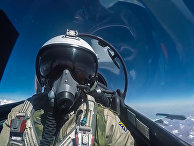 Пилот истребителя Су-30 ВКС РФ во время боевого вылета в Сирии Пилот истребителя Су-30 ВКС РФ во время боевого вылета в Сирии