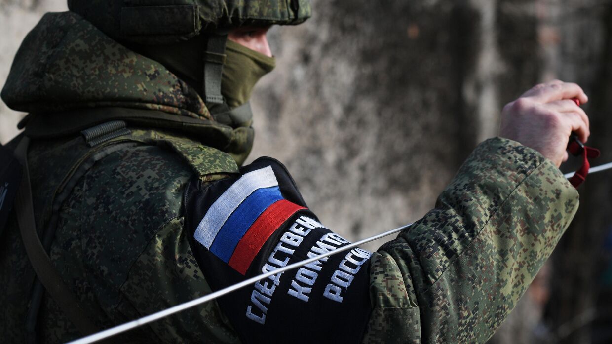 Работа сотрудников СК РФ на месте обстрела в Донецке