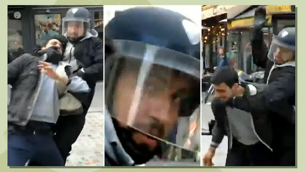 А. Беналла в полицейской форме