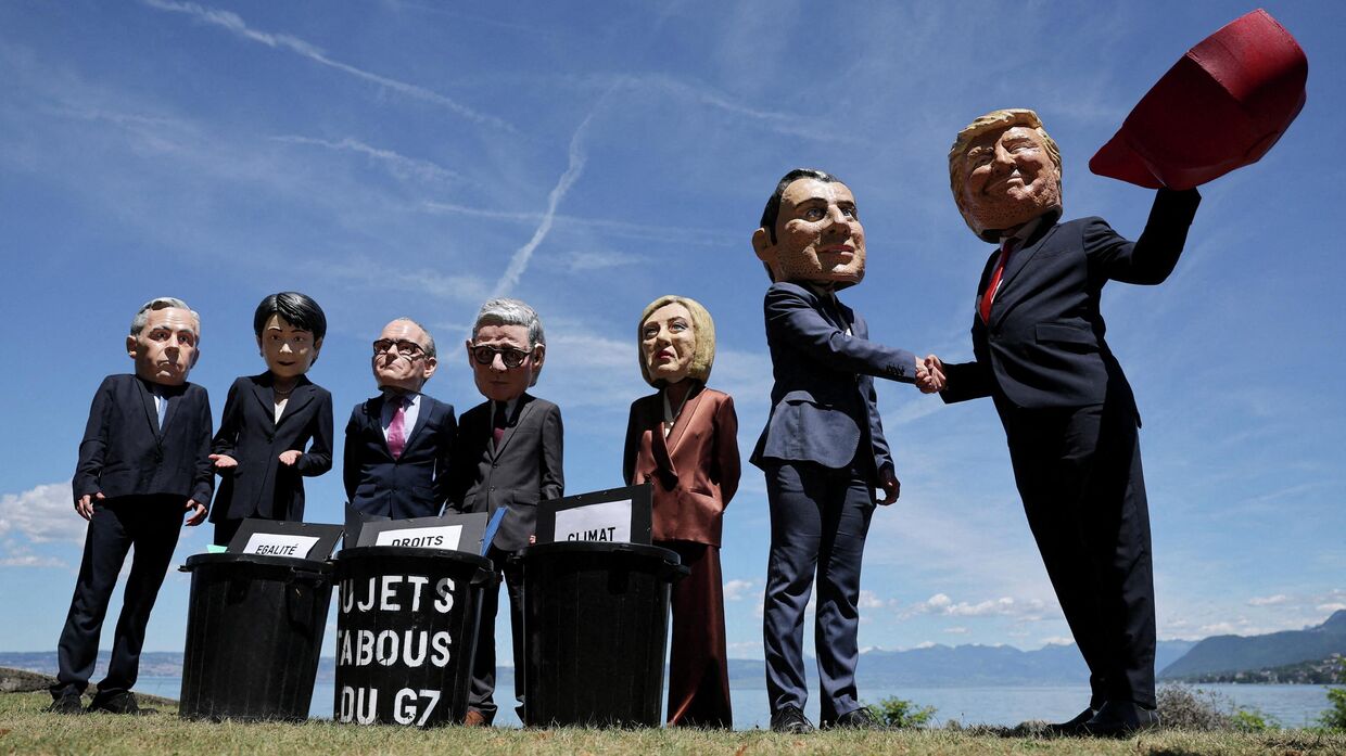 Протестующие против проведения саммита G7 в Эвиан-ле-Бэн, 14 июня 2026 г. 