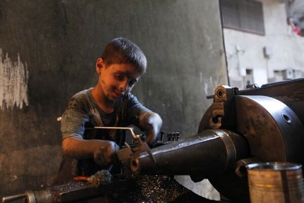 Десятилетний мальчик Исса из города Алеппо в Сирии