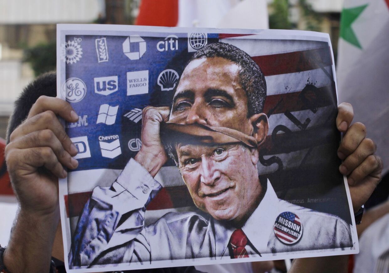 Плакат с изображением Джорджа Буша, одевающего маску Барака Обамы