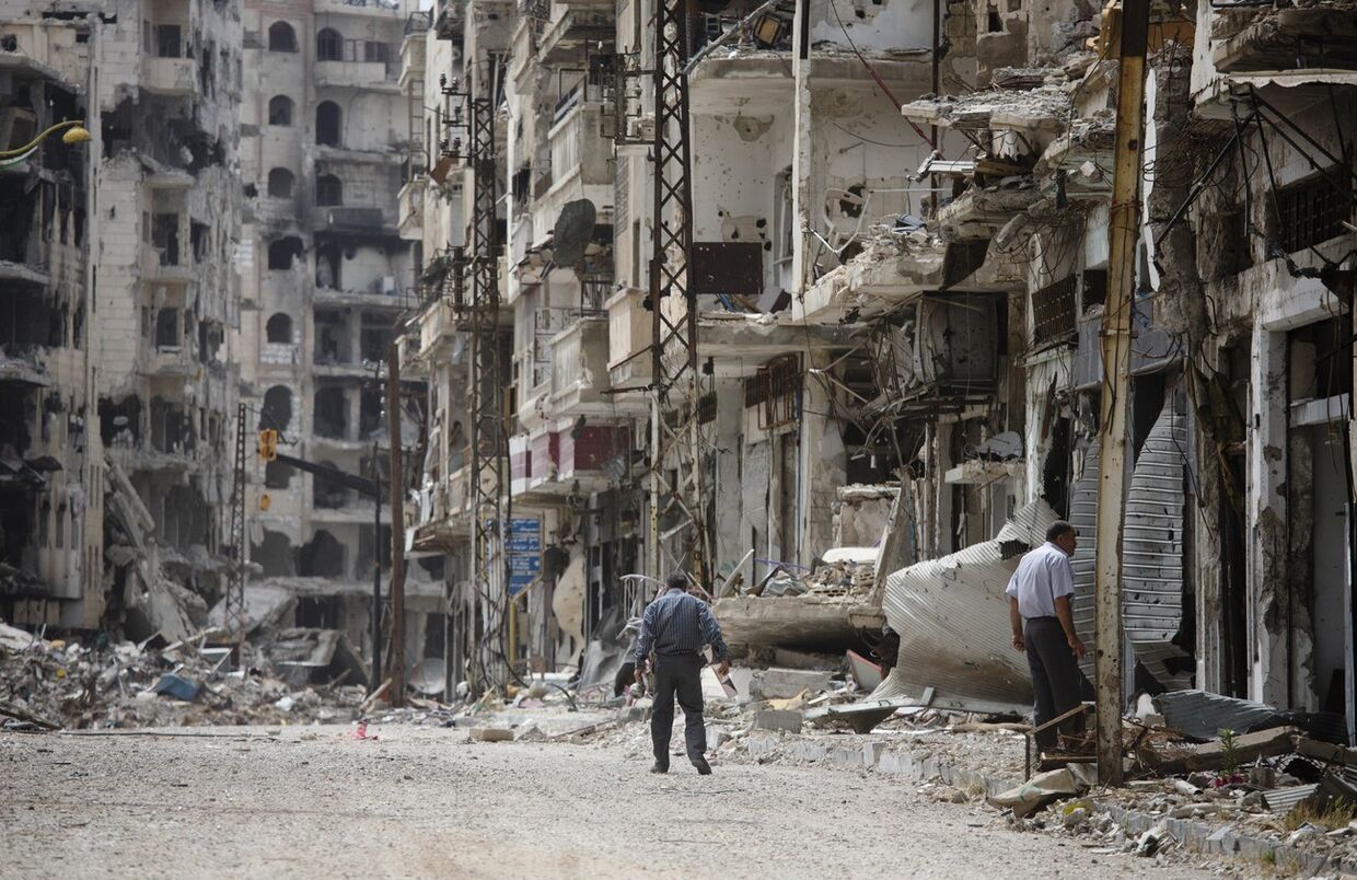 Разрушенные здания на улице Хомса