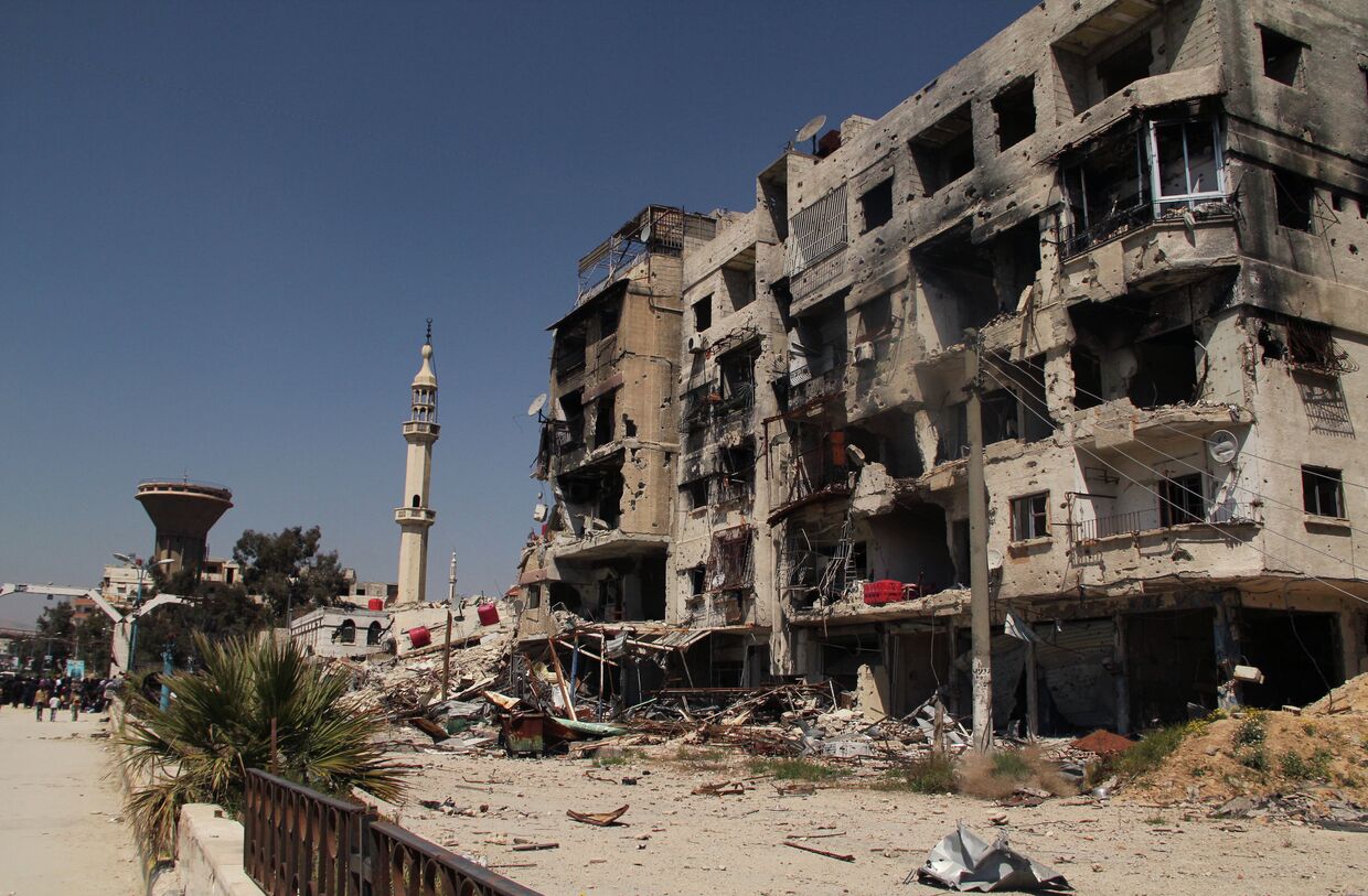Разрушенный дом в лагере палестинских беженцев Ярмук на окраине Дамаска