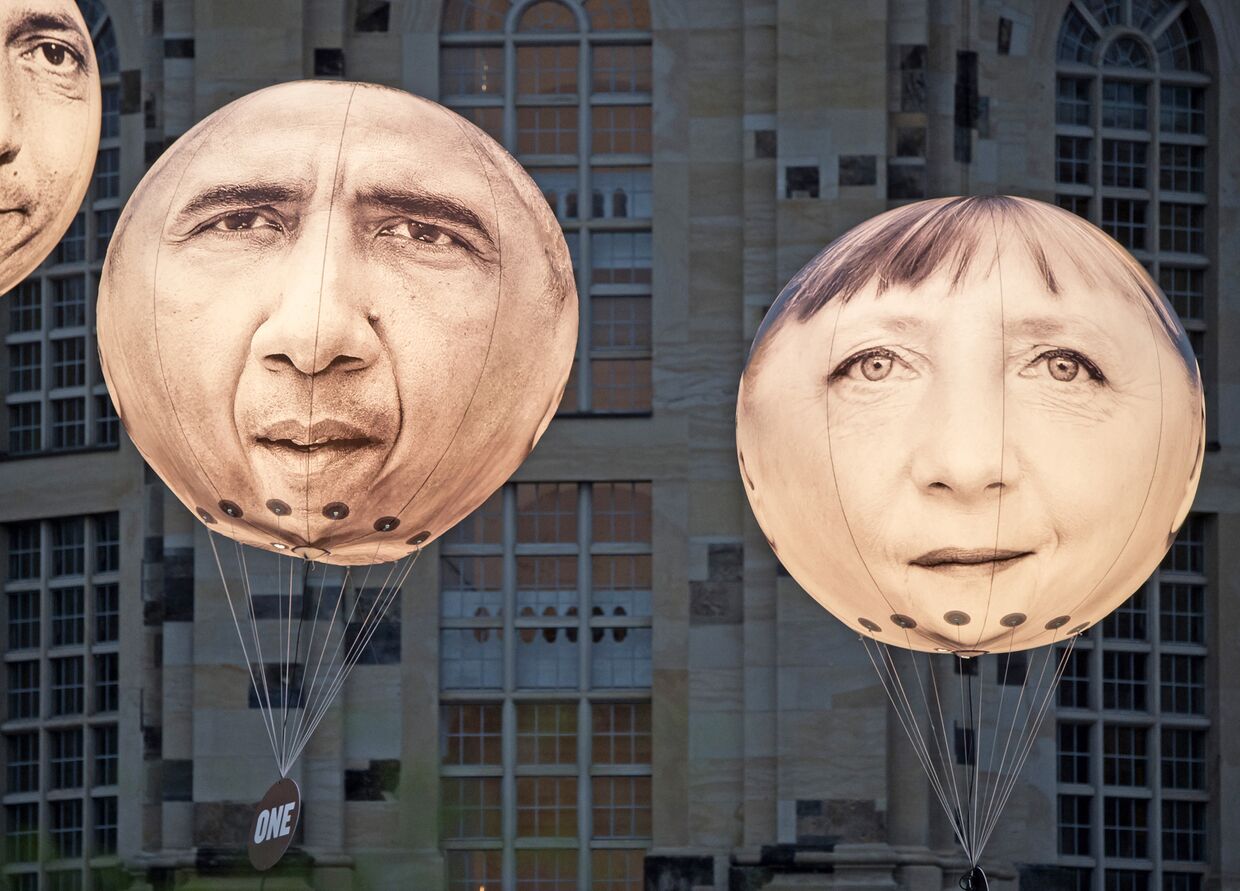 Шары с портретами Ангелы Меркель и Барака Обамы накануне встречи министров финансов G7 в Дрездене