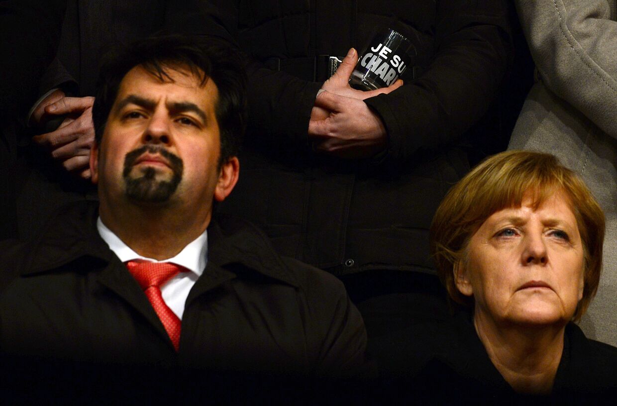 Председатель объединения «Центральный совет мусульман Германии» Айман Мазиек и канцлер ФРГ Ангела Меркель
