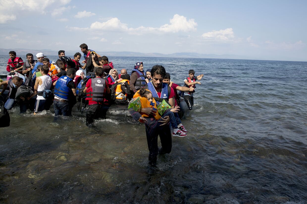 Беженцы, прибывшие на остров Лесбос из Турции