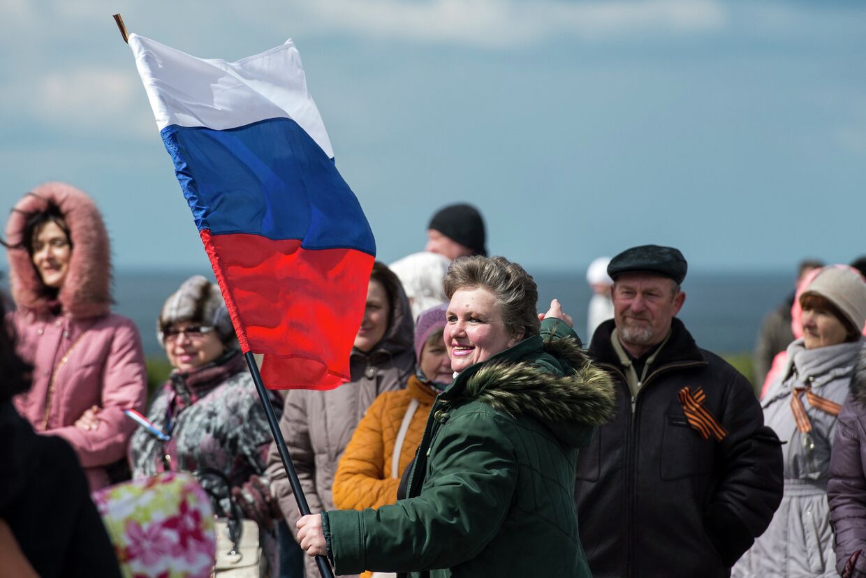 Участники праздничных мероприятий в Севастополе, посвященных годовщине Крымской весны.