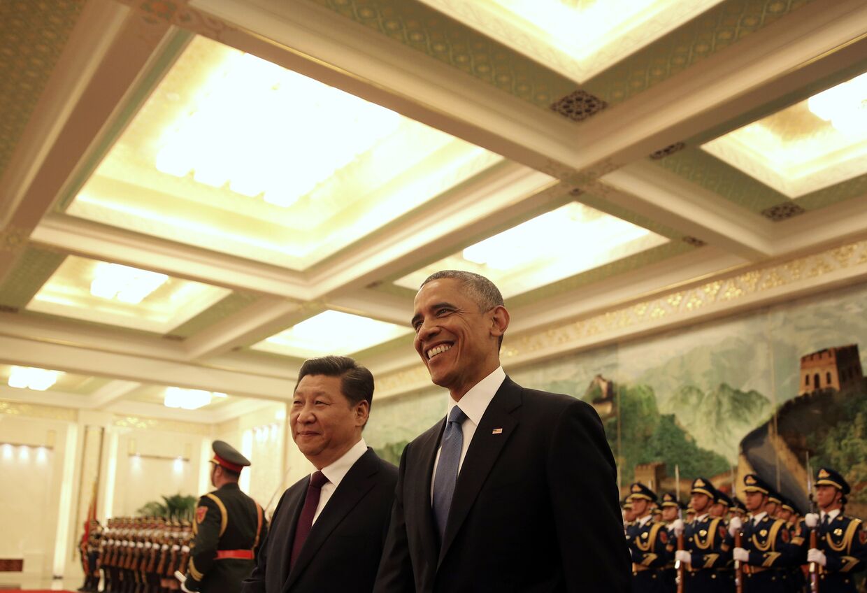 Председатель КНР Си Цзиньпин и президент США Барак Обама во время встречи в Пекине