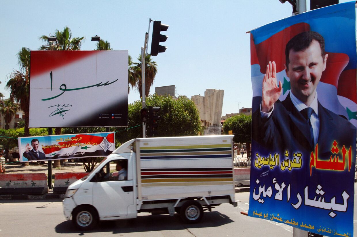 Плакаты с Башаром Асадом накануне выборов в Дамаске, май 2014 года