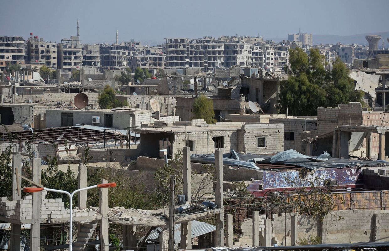 Разрушенные здания в городе Маадамия в пригороде Дамаска
