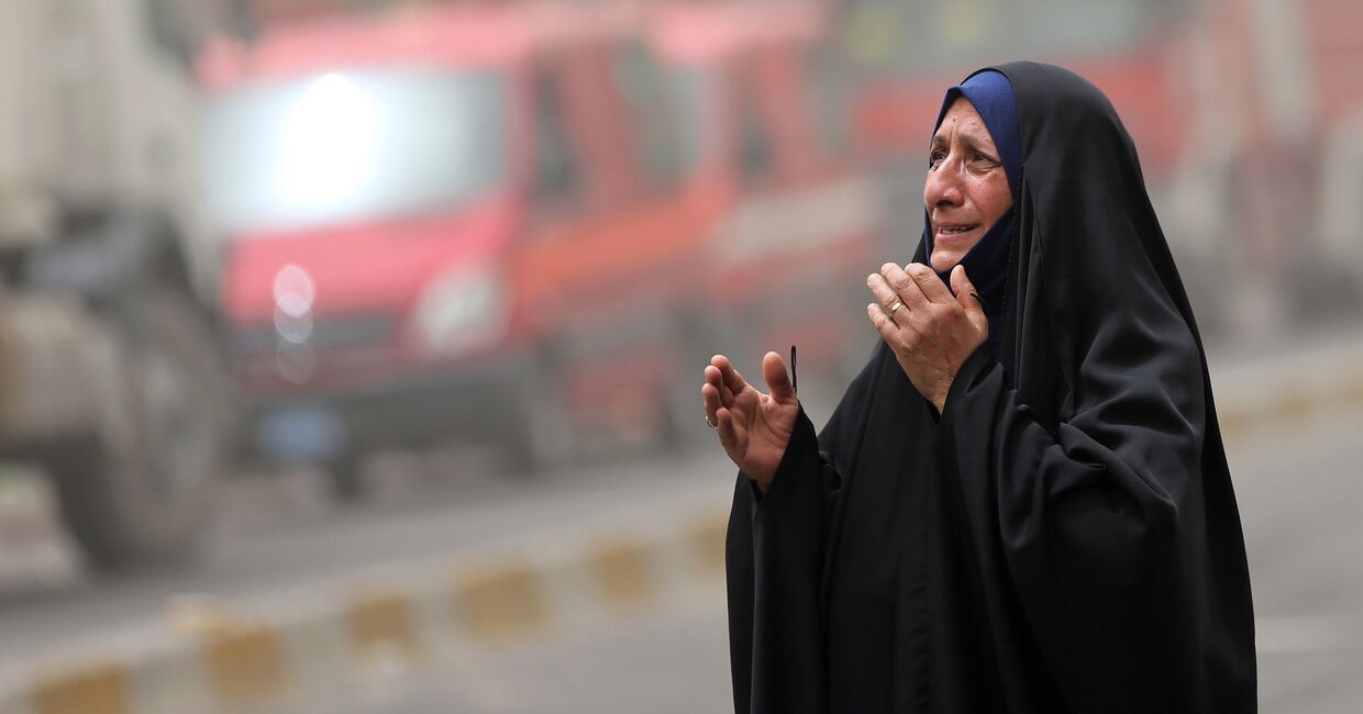 Женщина на месте террористического акта в Багдаде