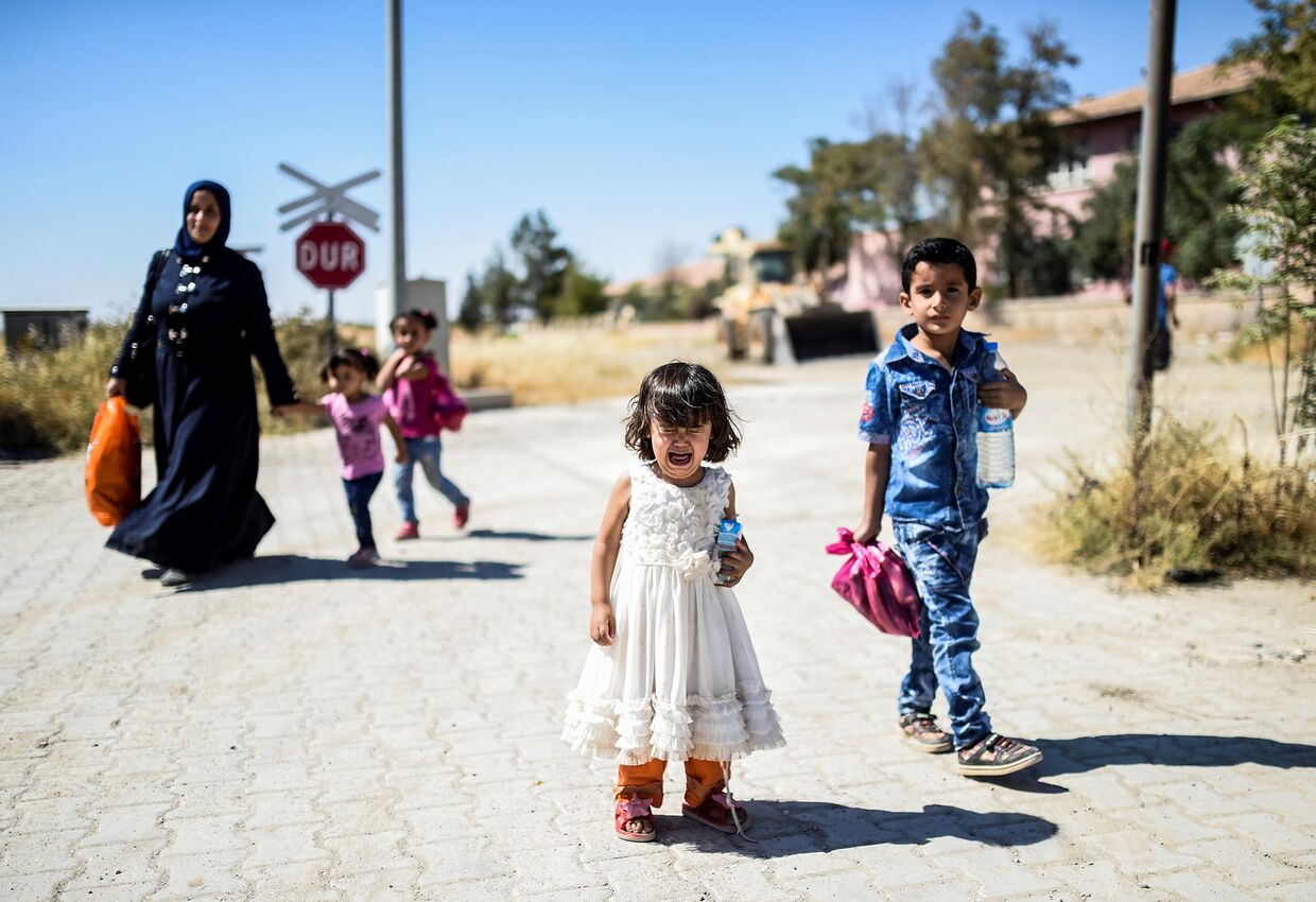 Сирийские беженцы в городе Джераблус, Сирия. Сентябрь 2016