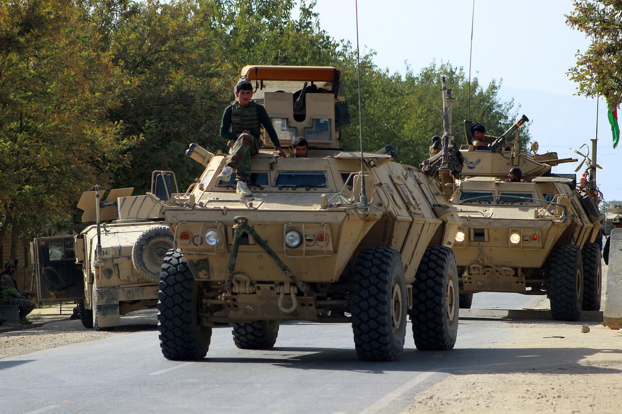Афганские силы безопасности во время продолжающихся боевых действий с боевиками «Талибана» в Кундузе