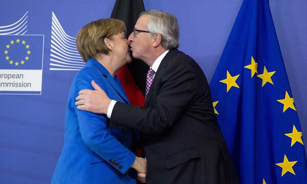 Канцлер Германии Ангела Меркель и председатель Европейской комиссии Жан-Клод Юнкер