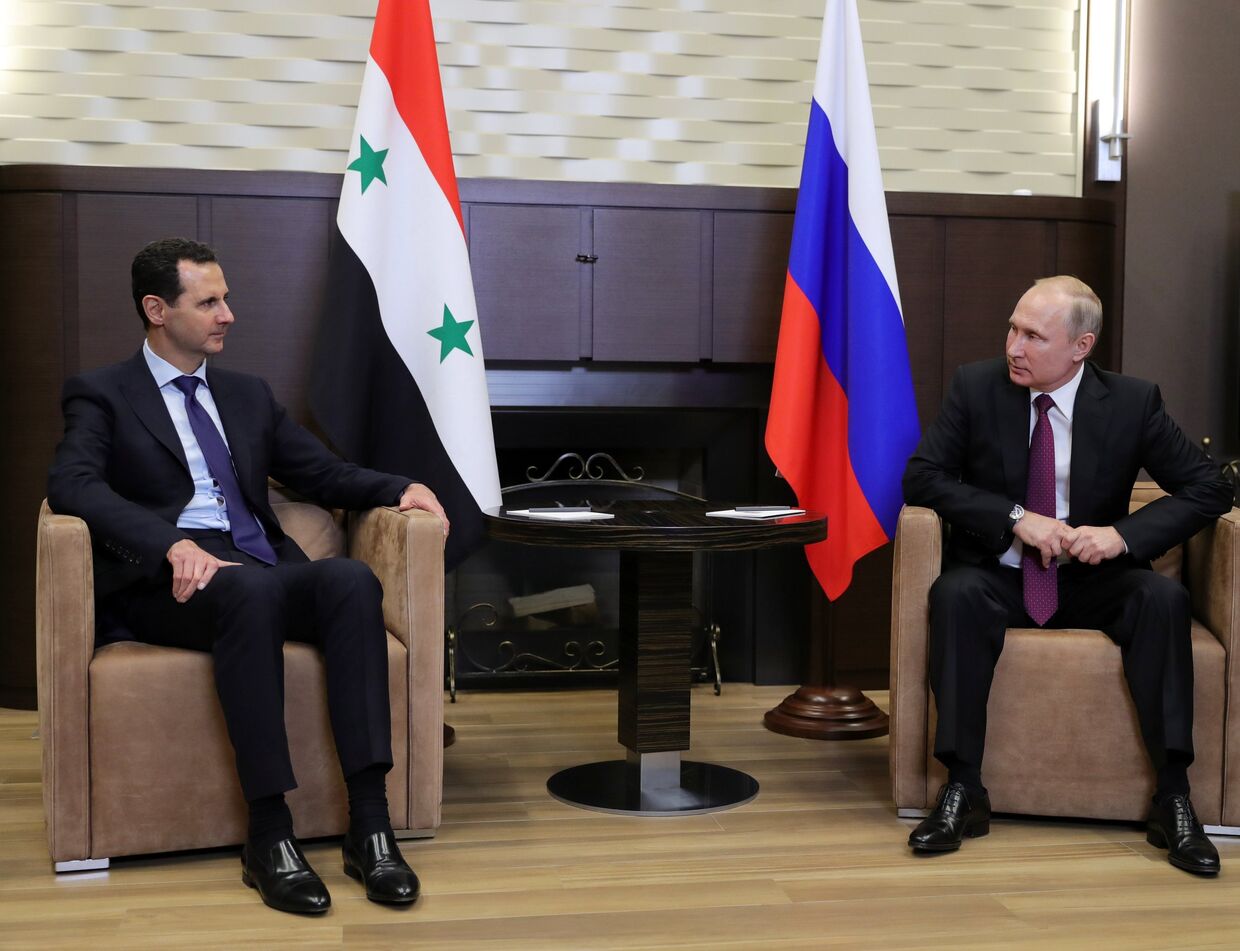Президент РФ Владимир Путин и президент Сирийской арабской республики Башар Асад во время встречи. 17 мая 2018