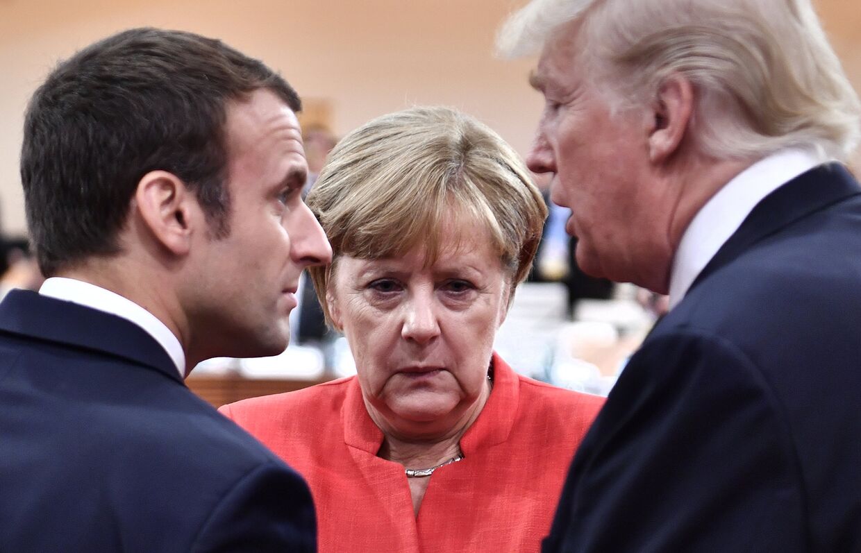 Президент Франции Эммануэль Макрон, канцлер Германии Ангела Меркель и президент США Дональд Трамп