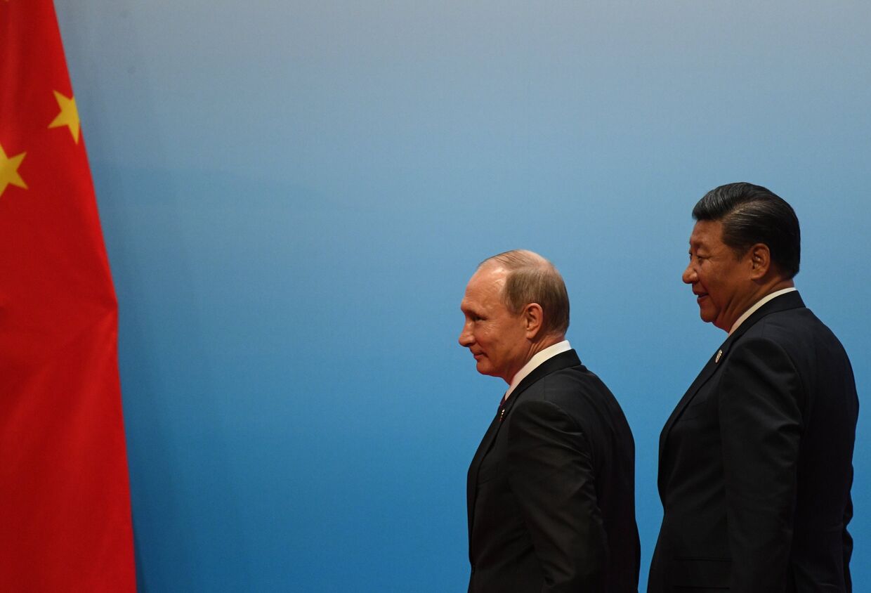 Президент РФ Владимир Путин и председатель КНР Си Цзиньпин во время встречи лидеров БРИКС. 4 сентября 2017