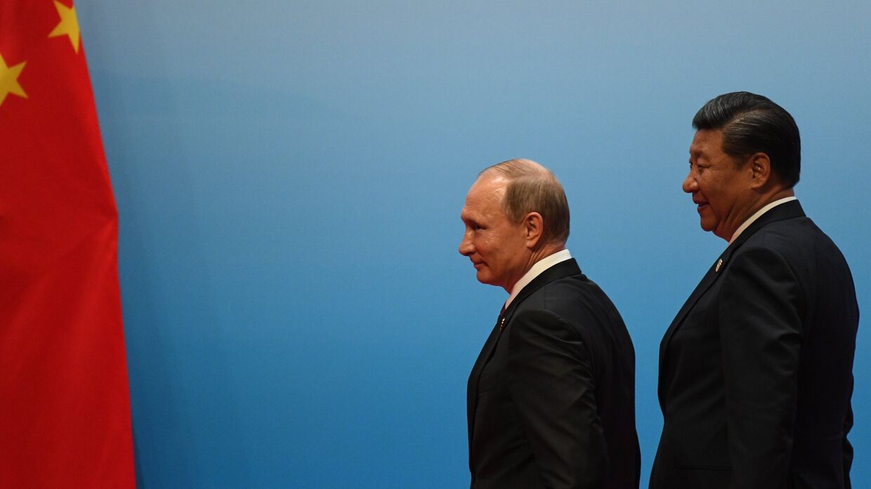 Президент РФ Владимир Путин и председатель КНР Си Цзиньпин во время встречи лидеров БРИКС. 4 сентября 2017