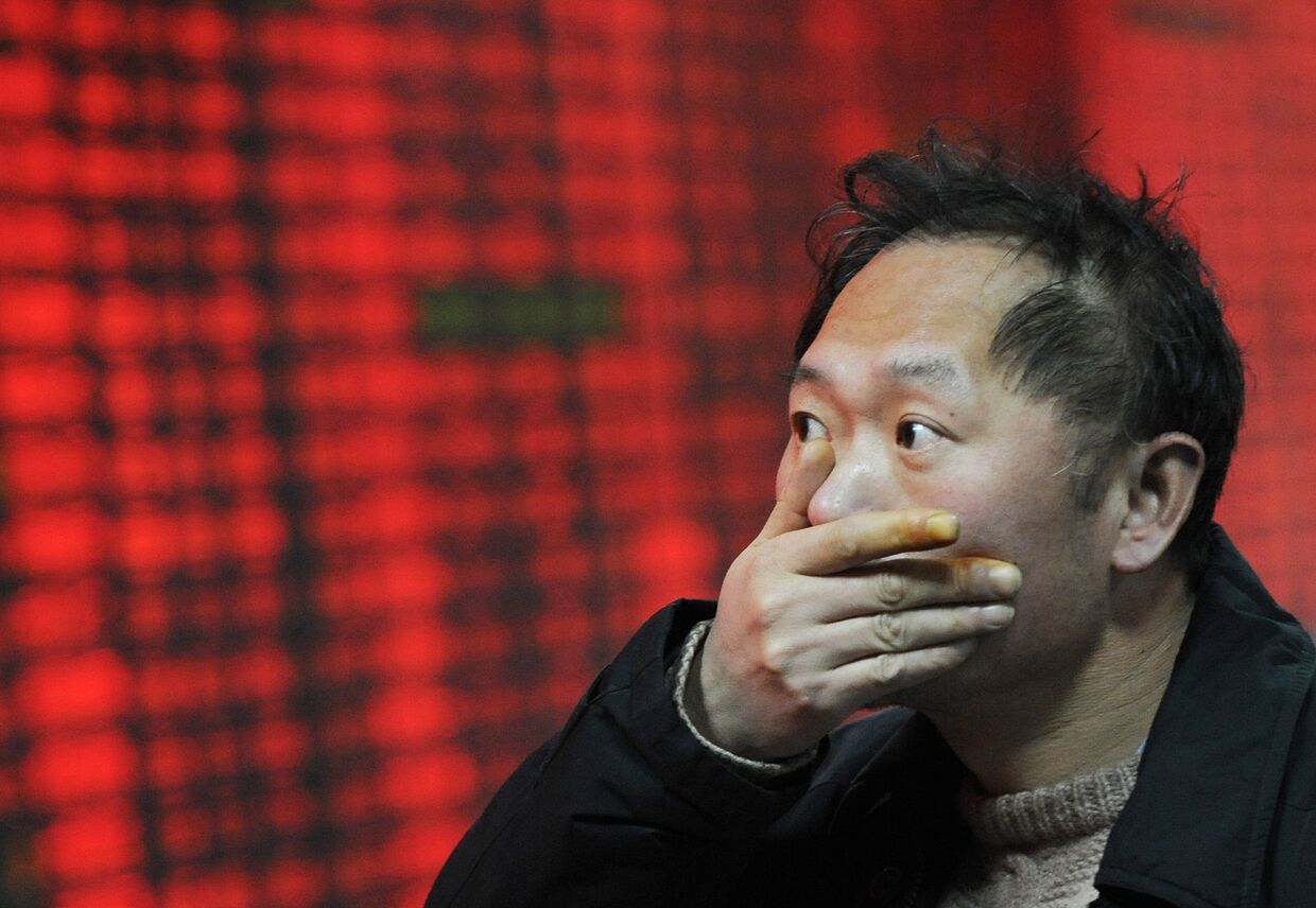 Работник биржи по ценным бумагам в Шанхае во время кризиса 2008 года
