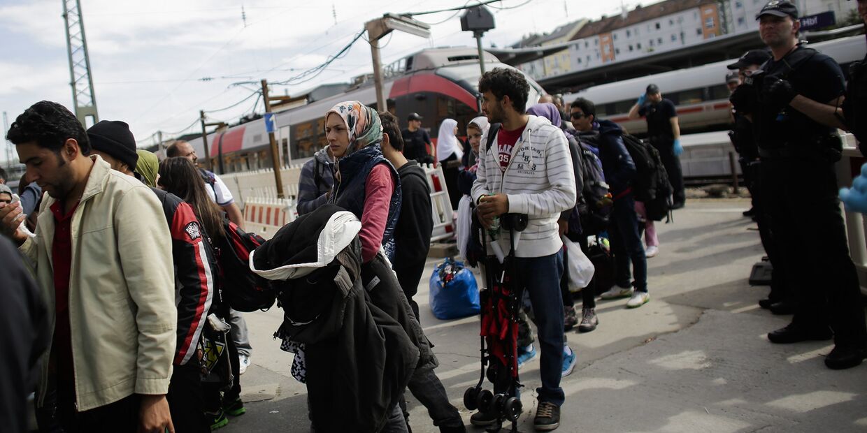 Прибывшие мигранты на перроне одной из станций Германии
