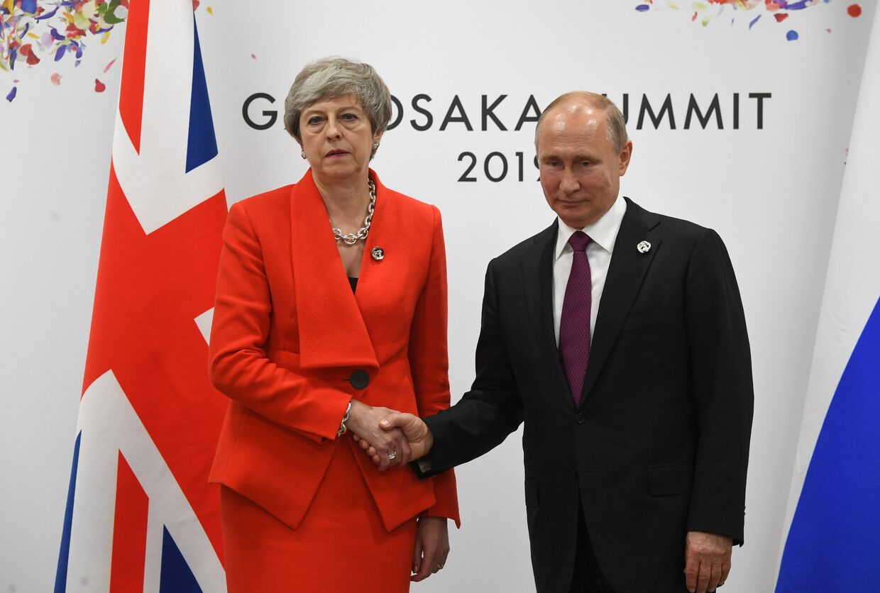 Президент РФ Владимир Путин и премьер-министр Великобритании Тереза Мэй