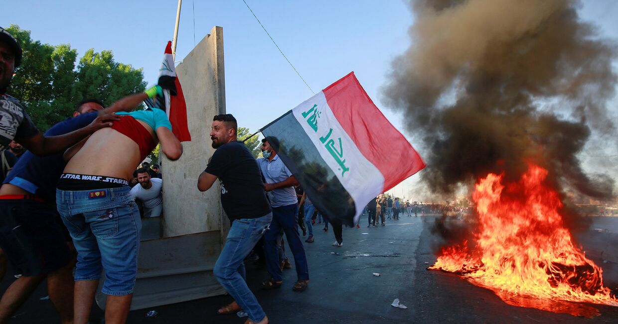Участники акции протеста в Багдаде, Ирак