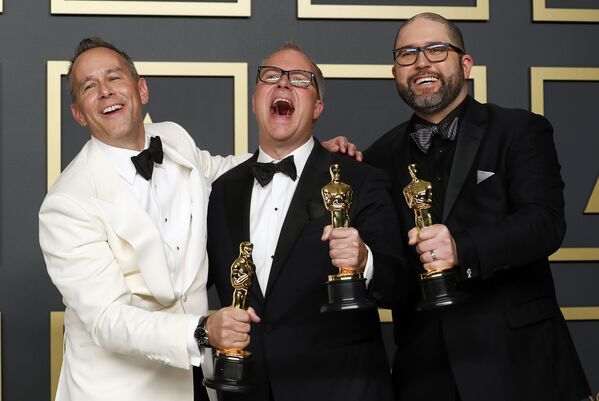Джонас Ривера, Марк Нильсен и Джош Кули на церемонии вручения премии Оскар в Лос-Анджелесе