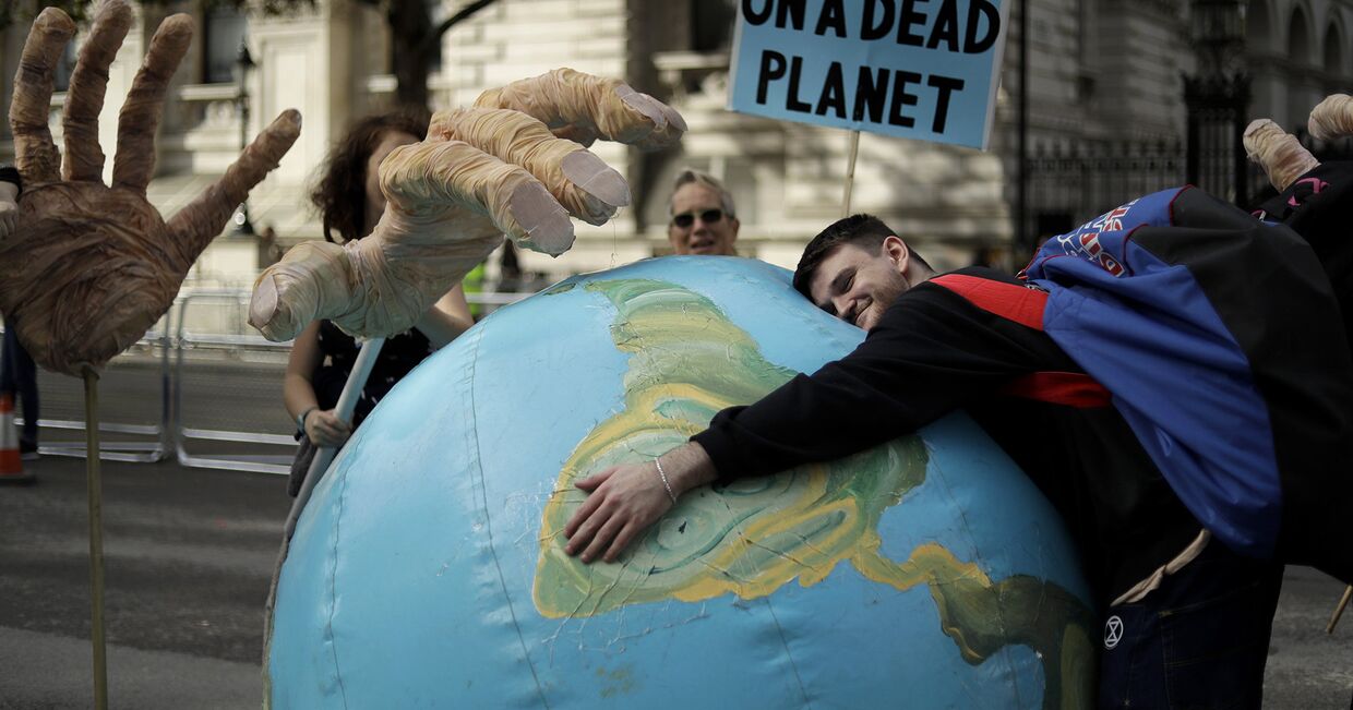 Протестующий против изменения климата в Лондоне