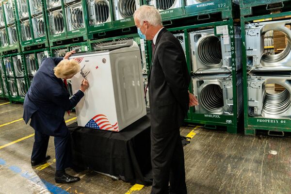President Donald J. Trump signs a washing machine during his tour Thursday, August 6, 2020, at the Whirlpool Corporation Manufacturing Plant in Clyde, Ohio.