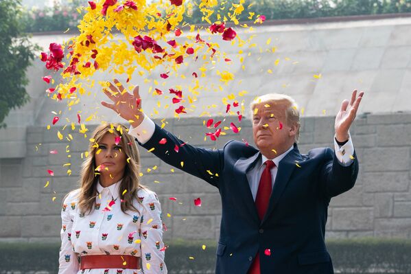 President Donald J. Trump and First Lady Melania Trump scatter flower petals in honor of Mahatma Gandhi during a wreath laying ceremony at the Raj Ghat Tuesday, Feb. 25, 2020, in New Delhi, India.