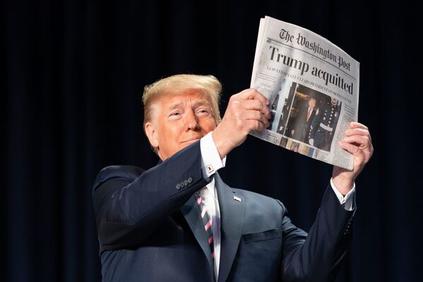 President Donald J. Trump holds up a copy of The Washington Post during the 2020 National Prayer Breakfast Thursday, Feb. 6, 2020, at the Washington Hilton in Washington, D.C.