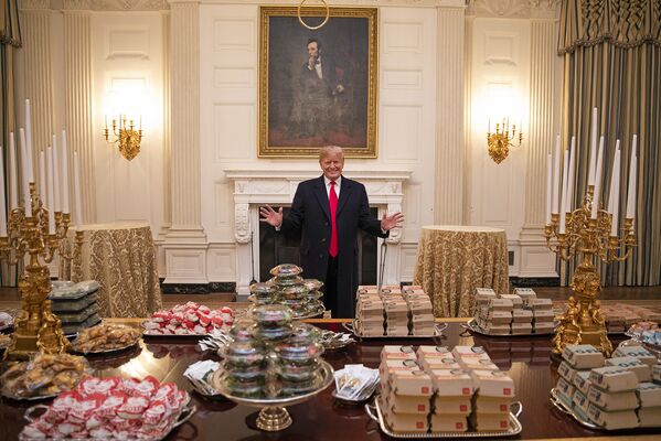 President Donald J. Trump welcomes members of the press to the State Dining Room Monday, January 14, 2019, where the 2018 NCAA Football National Champions, the Clemson Tigers, will be welcomed with food from Domino’s, McDonald’s, Wendy’s and Burger King.