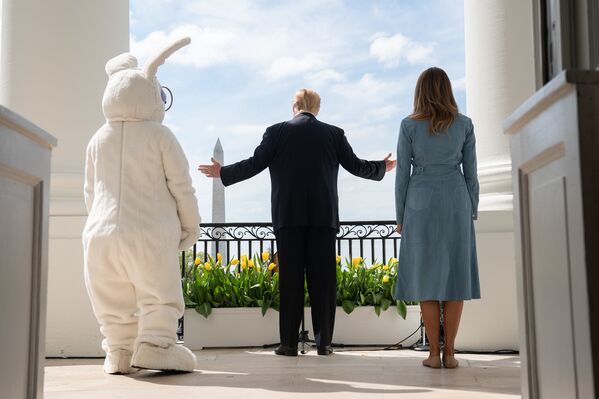 President Donald J. Trump and First Lady Melania Trump stand on the South Portico balcony of the White House as they welcome guests Monday, April 22, 2019, to the 141st White House Easter Egg Roll.