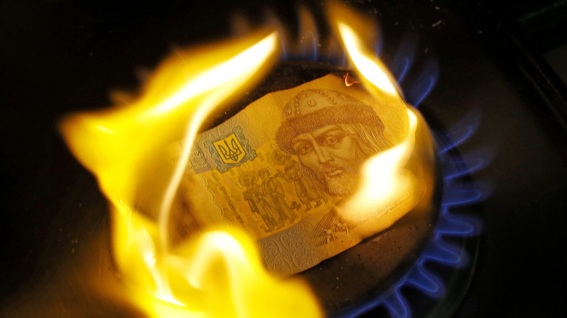 Одногривенная купюра горит на газовой конфорке - ИноСМИ, 1920, 14.02.2022