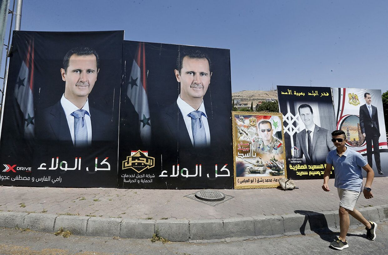 Плакаты с изображением президента Сирии Башара Асада в предверии президентских выборов в Дамаске