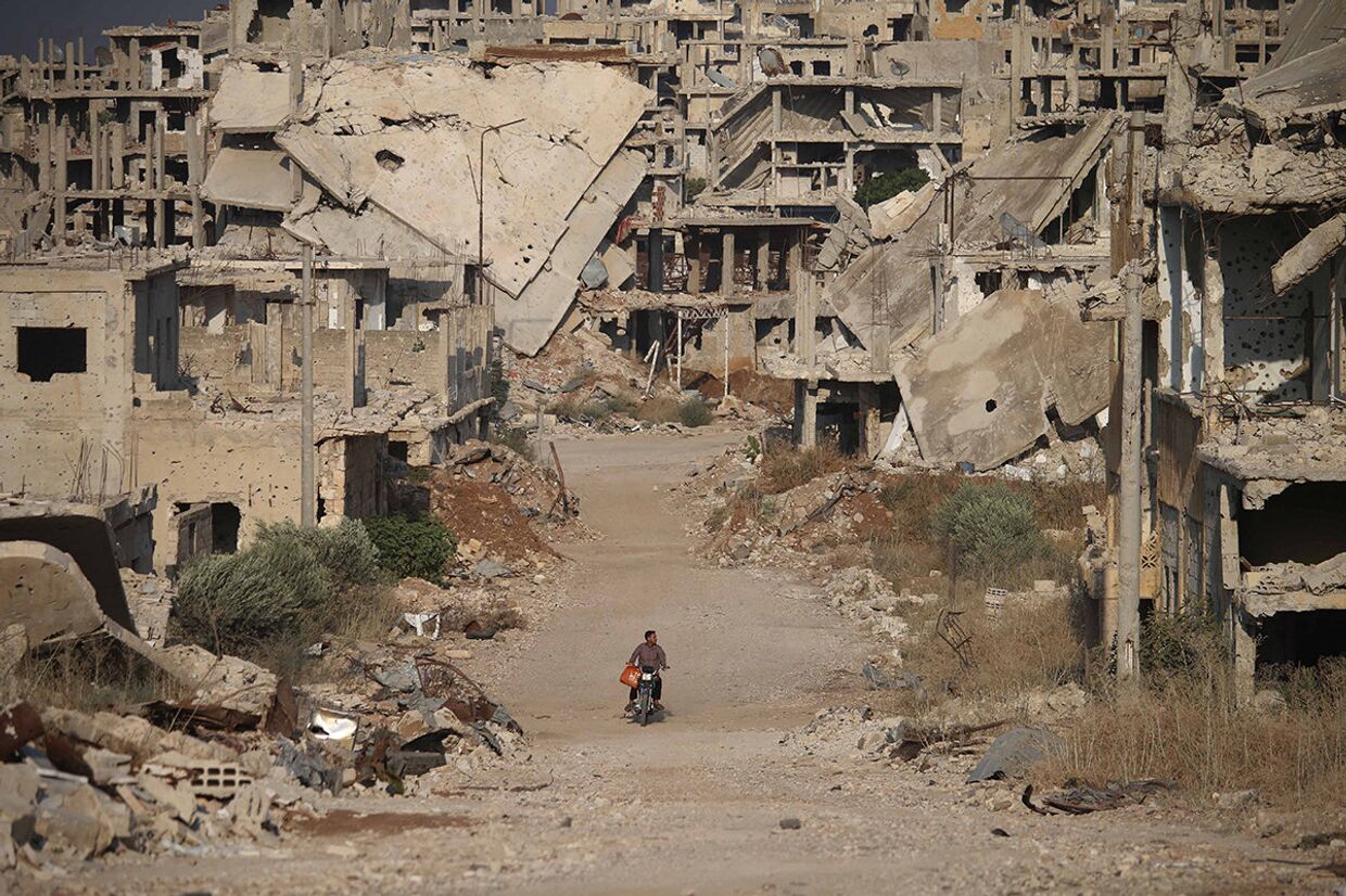 Руины зданий в городе Дараа, Сирия